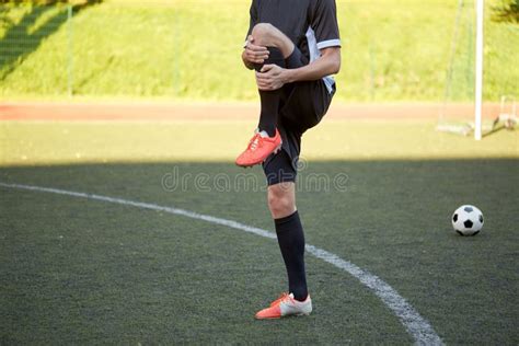 Soccer Player Stretching Leg On Field Football Stock Photo Image Of