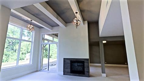 Put your desired ceiling height measurements in the construction contract you and your contractor sign. Different ceiling heights break up this 14' basement ...