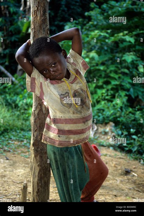A Young Baka Pygmy Boy In A Remote Village In The Rainforest Bordering