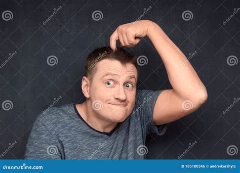 Portrait Of Funny Man Scratching Head Stock Photo Image Of Forget