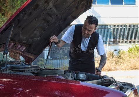 Mature Man Repair A Breakdown In His Car Engine With Tools Stock Image