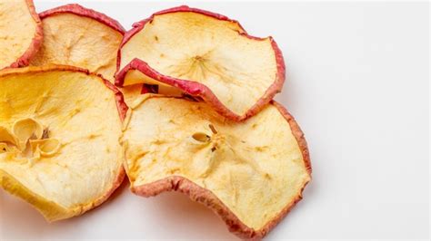 Free Photo Side View Of Dried Apple Slices On White Background