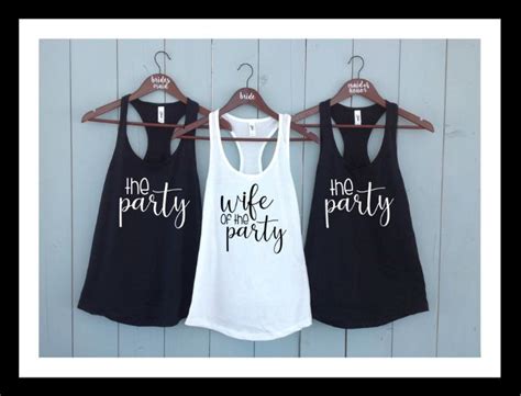 Three Womens Tank Tops Hanging On A Rack With The Words Two Party And One