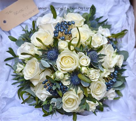 Purple & blue wedding bouquets. Wedding Flowers Blog: Laura's Christmas Wedding Flowers ...