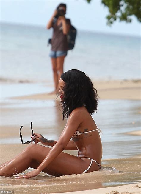 Rihanna Takes Part In Yet Another Watery Photo Shoot In White Bikini