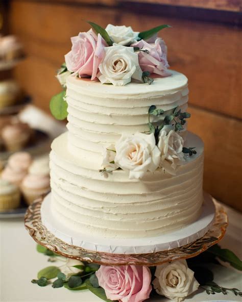 beautiful small two tiered textured buttercream wedding cake with custom dessert table by bijo