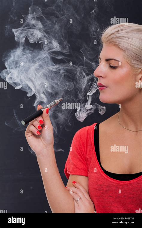 Young Attractive Blonde Woman Smoking A E Cigarette Stock