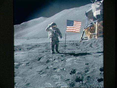 Astronaut David Scott Gives Salute Beside Us Flag During Eva