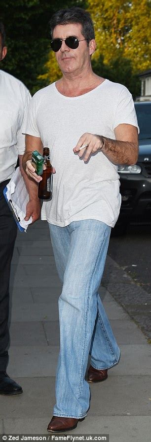 Simon Cowell Has A Cigarette In One Hand At Bash With Lauren Silverman Daily Mail Online