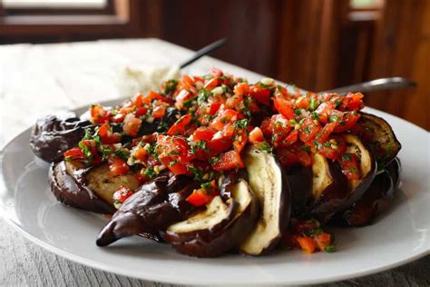 Roasted eggplant and garlic is tossed with chickpeas in this mediterranean salad with feta cheese and fresh parsley. Grilled Eggplant Side Dish - Weekend at the Cottage