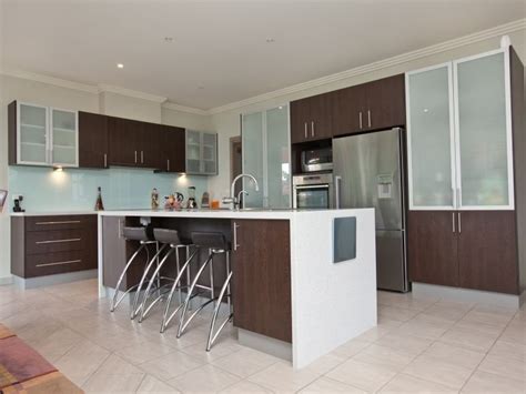 A little herringbone at the backsplash works for me. Modern u-shaped kitchen design using granite - Kitchen ...