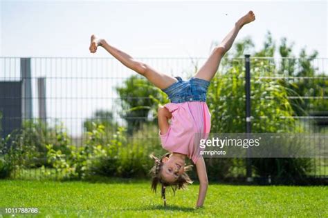 Girl Doing Cartwheel Photos And Premium High Res Pictures Getty Images