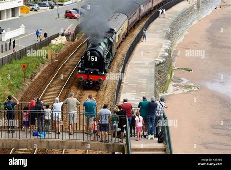 People Watching The Royal Duchy Steam Train Passing Through Dawlish