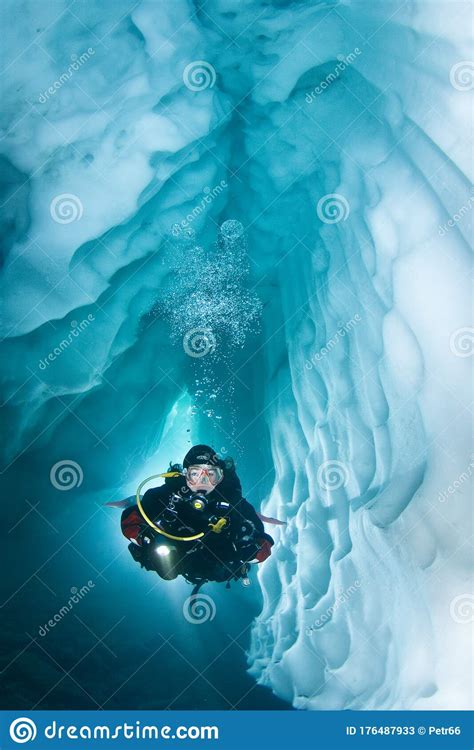 Scuba Diver In A Ice Cave Underwater Stock Image Image