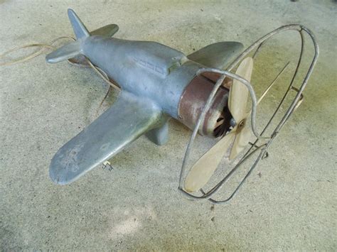 You can buy airplane ceiling fan with light. c1940's CAST ALUMINUM AIRPLANE TABLE FAN