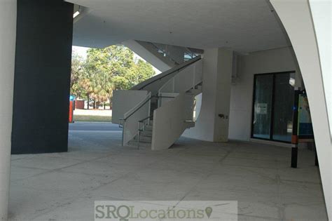 Gorgeous parking lot with folded wooden bars also black. Modern Parking Garage