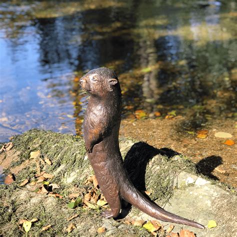 Kissing river otters ceramic ornament. Bronze Otter - Life-like handmade bronze garden ornaments