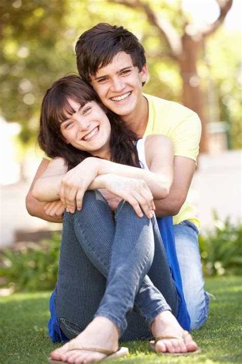 Romantic Teenage Couple Sitting In Park Stock Image Image Of Clothing Cuddling 14630641