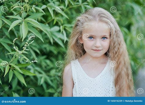 Close Up Portrait Of Beautiful Little Girl With Blonde Long Hair And