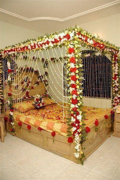 First night room decoration, indian wedding bedroom decoration for honeymoon with flowers and balloons. Bride & Groom: Wedding Room Decoration/Bedroom Decoration