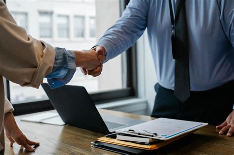 Crop Colleagues Shaking Hands In Office · Free Stock Photo