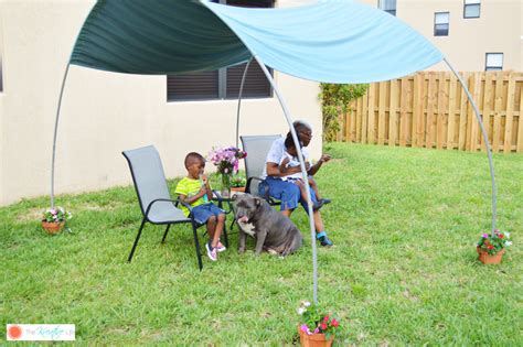 This modern canopy bed frame is constructed from 4 x 4's and 2 x 4's. DIY PVC Canopy for Backyard Shade - The Kreative Life