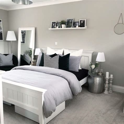 Light Grey And White Modern Bedroom With Picture Shelf Styling And