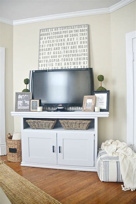 All of them start out with a basic design, the materials you use on each bookshelf will be what will sets it apart from others and makes it match your home décor. DIY TV Console Cabinet - Liz Marie Blog