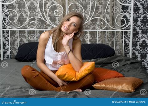 Pretty Girl Sitting On Bed Stock Photo Image Of Attractive 25727944