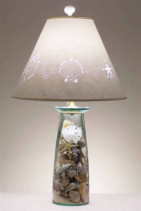 Measure how tall you want your wire lampshade frame to be, then cut the remaining wire coat hangers into that height measurement plus 2 inches each. custom seashell lamp - InfoBarrel Images
