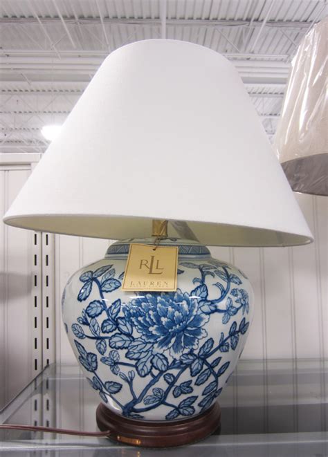 Lustrous red glazed background on a chinese porcelain jar lamp body, decorated with fine chinese porcelain vase with a delightful ming blue and white flower and vine art motif. apartmentf15: ralph lauren blue&white asian style lamps