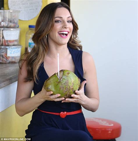 Kelly Brook Struggles To Keep Hold Of A Cat As It Tries To Escape Her