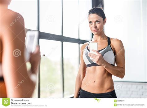 Beautiful Sportive Woman Smiling Posing For Mirror Selfie In Gym Stock Image Image Of