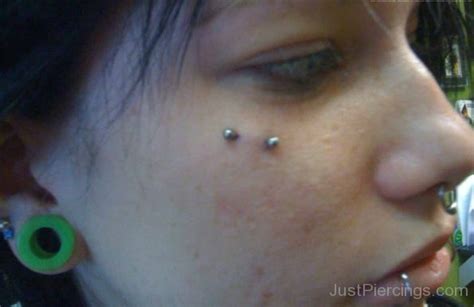 Lobe Stretching Lip And Butterfly Kiss Piercing