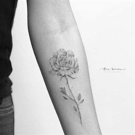 Single stem rose with horns tattoo on spine. 10 Beautiful Rose Tattoo Ideas for Women - crazyforus