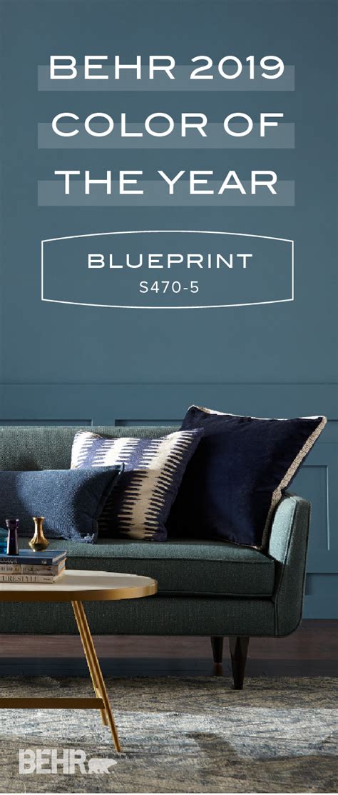 A Living Room With Blue Walls And Furniture In The Color Of The Year