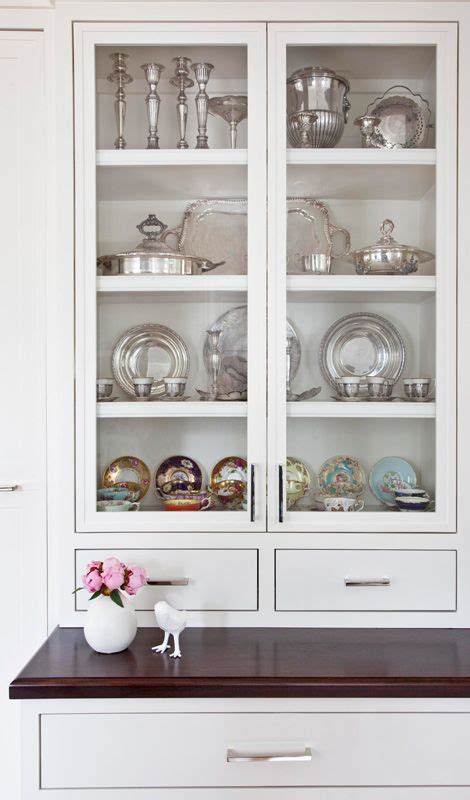 As you remove the items, carefully consider if the items will go back in the cabinet or not. Classically Modern Family Home | Glass kitchen cabinets ...