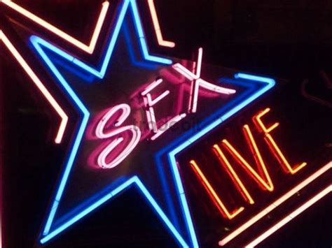 Neon Sign In A Red Light District With The Lettering Sex Live Do