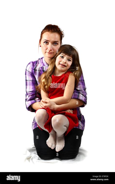 Kneeling Mother Holds Her Daughter In Arms Portrait On White