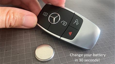 Pull on the bottom tab of the key, away. How to change the Key Fob Battery on 2017 - 2020 Mercedes ...