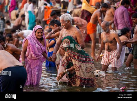 Indian Hindu Pilgrims Bathing In The Ganges River At Dashashwamedh Ghat In Holy City Of Varanasi