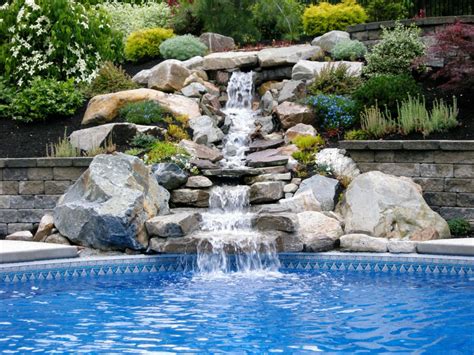 Wondering how to build a pool in your backyard but have no clue where to start? Natural Stone Waterfalls by Triad Associates | Triad ...