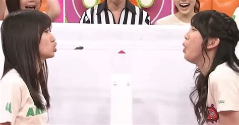 Women Try To Blow A Cockroach Into Each Others Mouths On Game Show Video