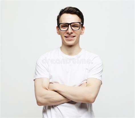 Young Man With Emotions On His Face A Grey Background Stock Image