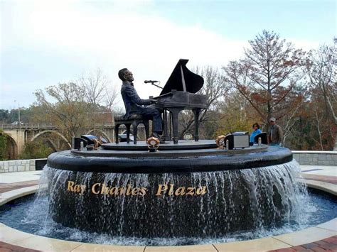 Rotating Bronze Sculpture Of Albany Ga Native Ray Charles In Downtown