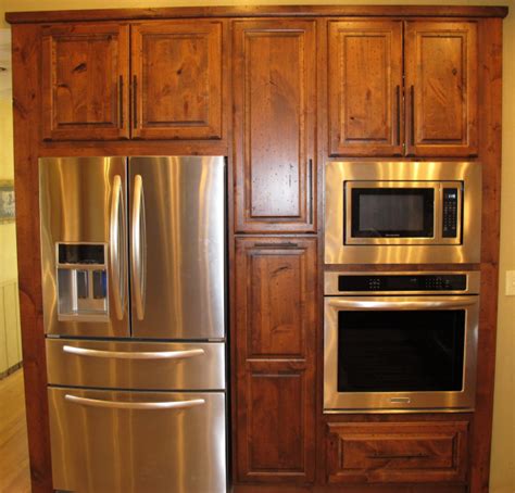 If you want to replace your existing kitchen cabinets, there are less expensive options than if you want to start if you opt for custom cabinets, expect to pay more for labor since it requires a higher level of skill to build and then install them. Built-in Oven and Refrigerator - HealthyCabinetmakers.com