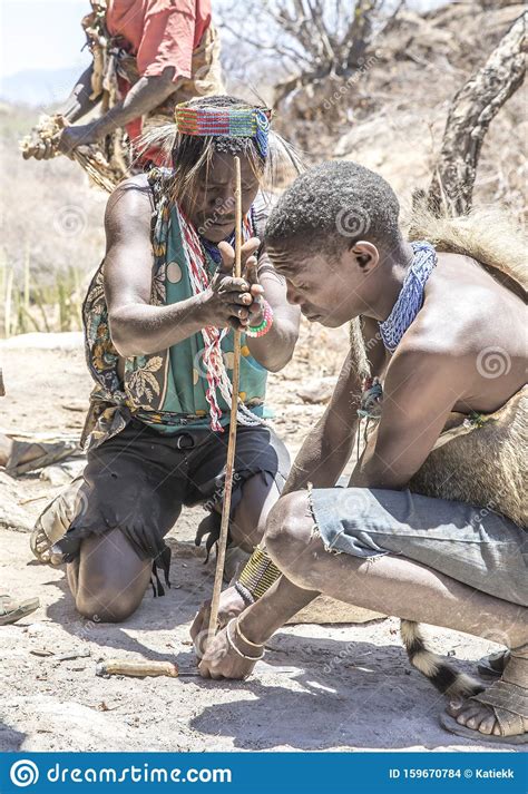 hadzabe men making fire editorial stock image image of national 159670784