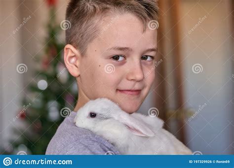 A Boy With A White Rabbit In His Hands Stock Photo Image Of Animal