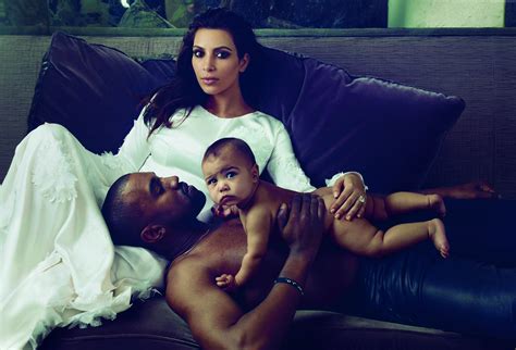 Kanye West Kim Kardashian And North West Laying On Black Leather
