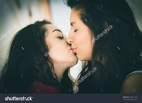 Closeup Portrait Of Cute Lesbian Couple In Love Kissing Outdoors Street View Cute Lesbian
